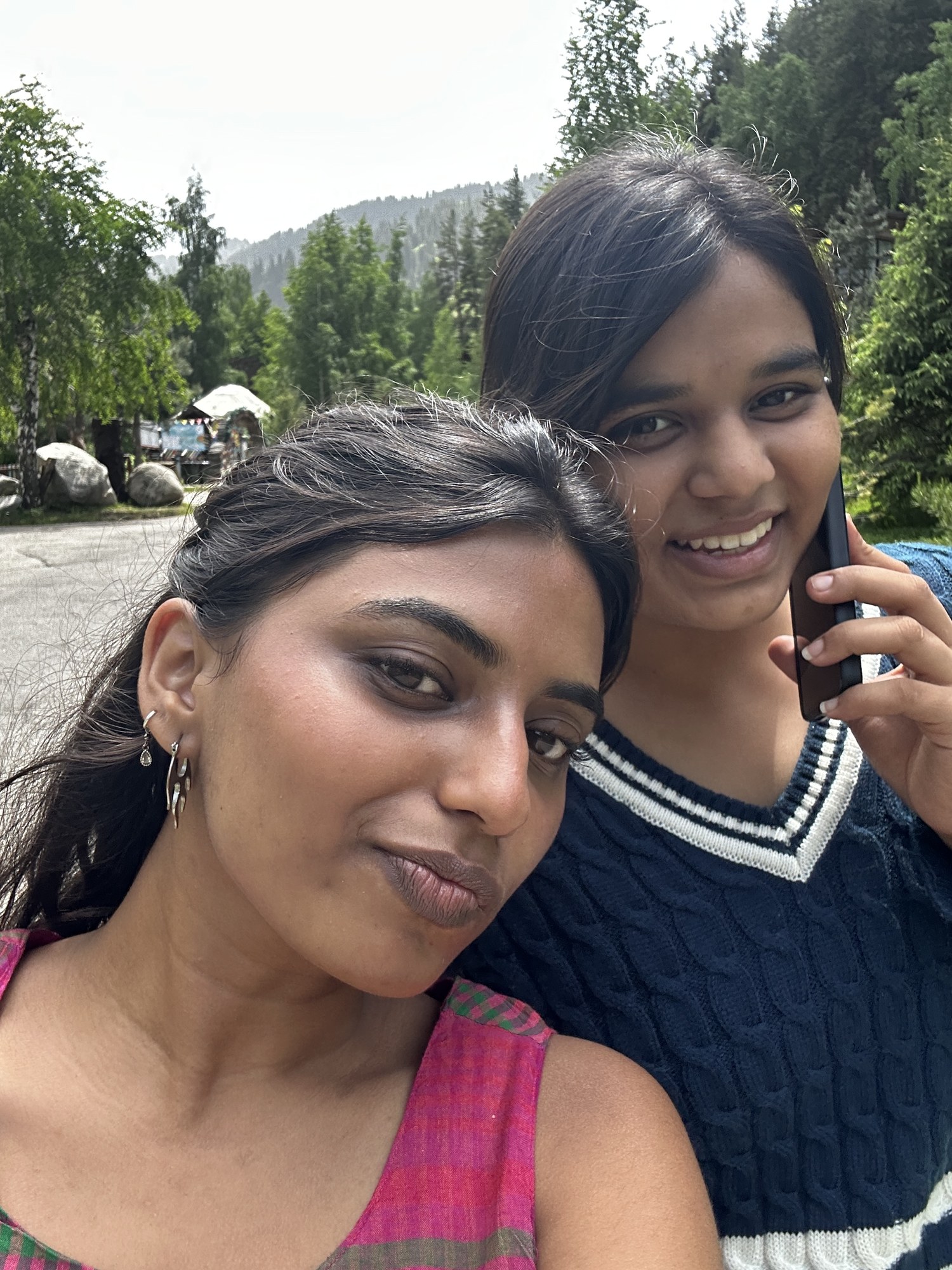Friends beside a mountain lake
